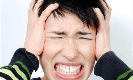 a-woman-puts-her-hands-over-ears-resized-600